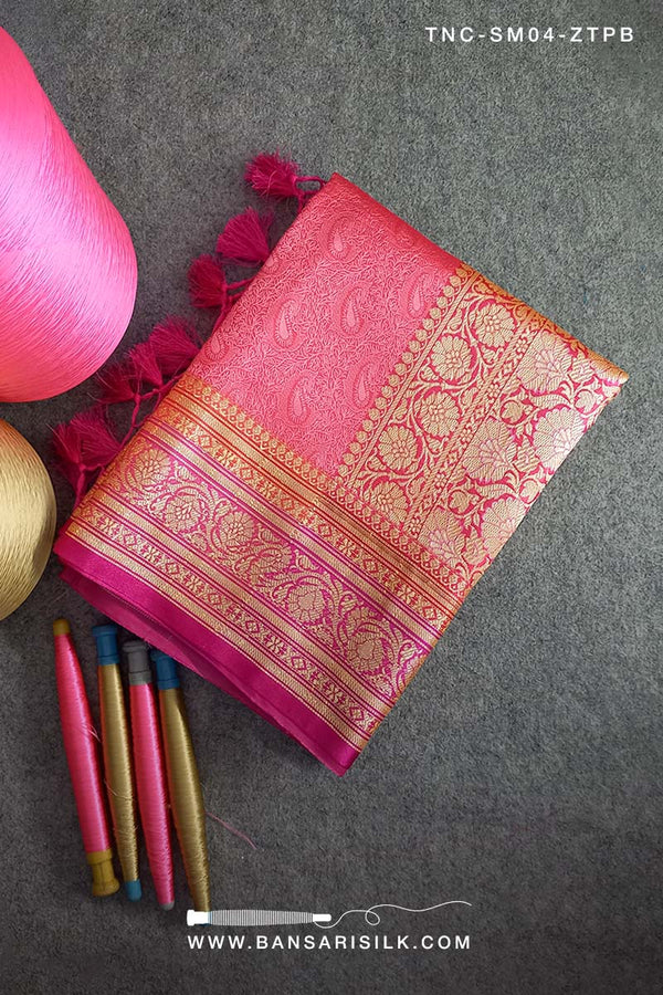 It is a pink and magenta Banarasi Silk Saree woven in Tanchoi design, best for Indian weddings by bansarisilk.com