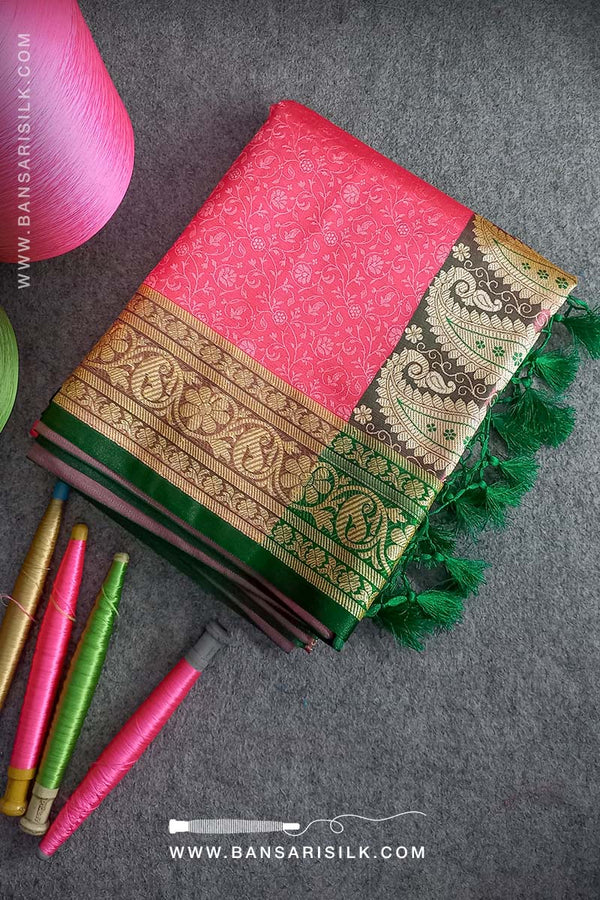 It is a pink and green Banarasi Silk Saree woven in Tanchoi design, best for Indian weddings by bansarisilk.com