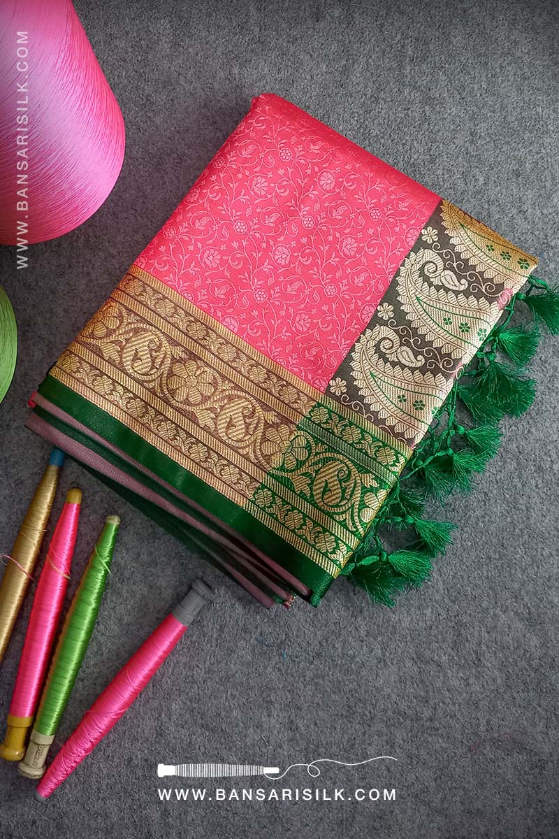 It is a pink and green Banarasi Silk Saree woven in Tanchoi design, best for Indian weddings by bansarisilk.com
