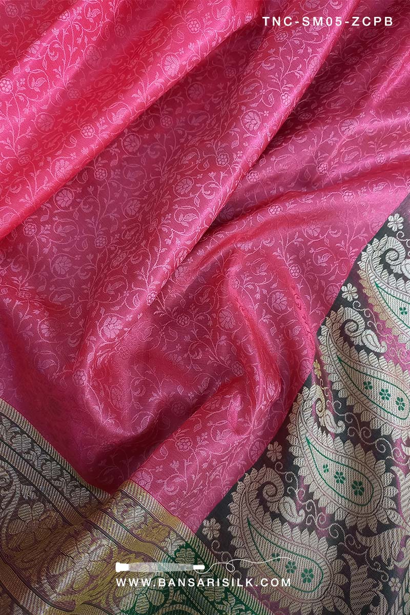 It is a pink and green Banarasi Silk Saree woven in Tanchoi design, best for Indian weddings by bansarisilk.com