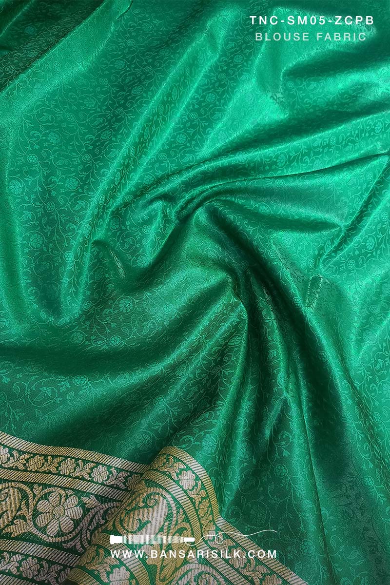 It is a pink and green Banarasi Silk Saree woven in Tanchoi design, best for Indian weddings by bansarisilk.com