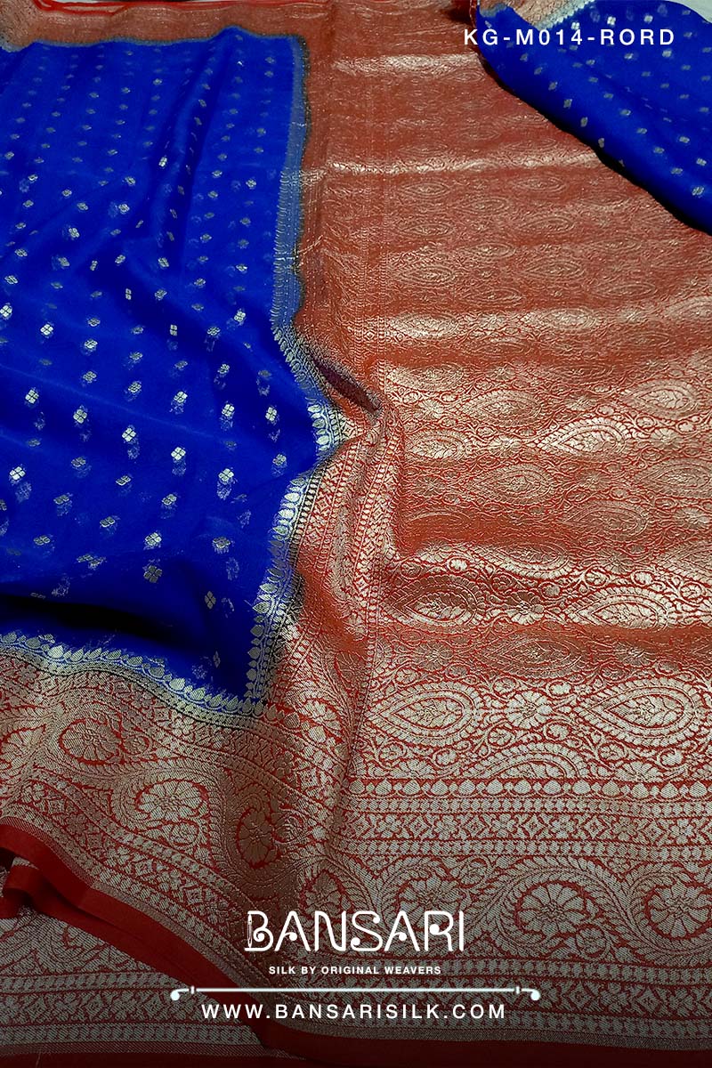red and blue georgette saree with intricate patterns and tassels, featuring the brand 'Bansari'.