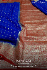 red and blue georgette saree with intricate patterns and tassels, featuring the brand 'Bansari'.