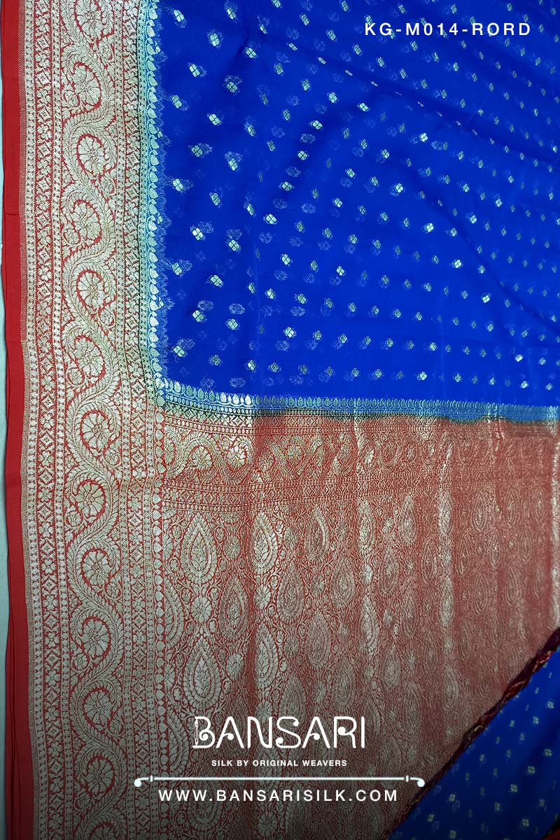 red and blue georgette saree with intricate patterns and tassels, featuring the brand 'Bansari'.