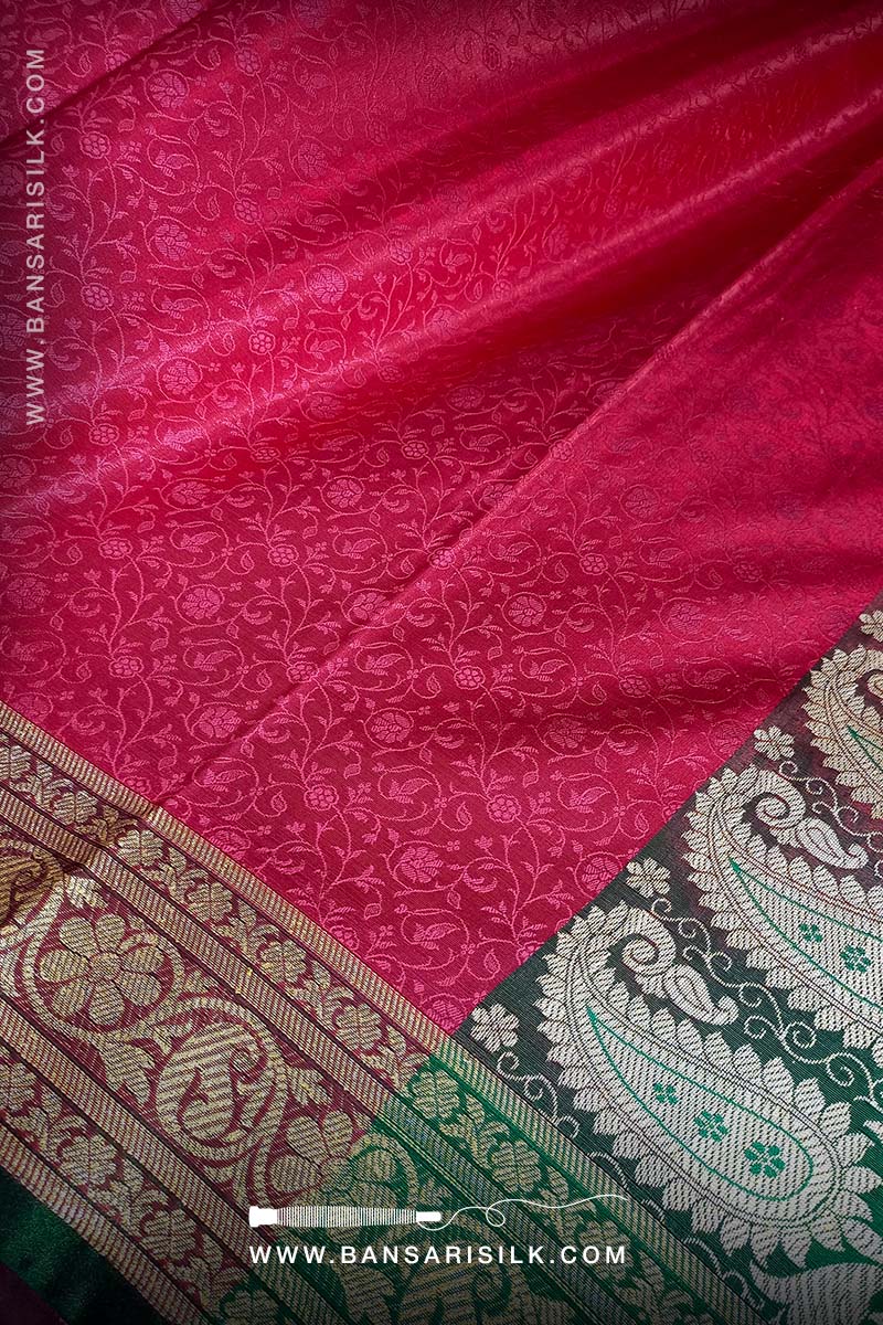 It is a red and green Banarasi Silk Saree woven in Tanchoi design, best for Indian weddings by bansarisilk.com