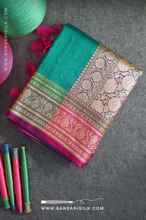 It is a sea-green Banarasi Silk Saree woven in Tanchoi design, best for Indian weddings by bansarisilk.com
