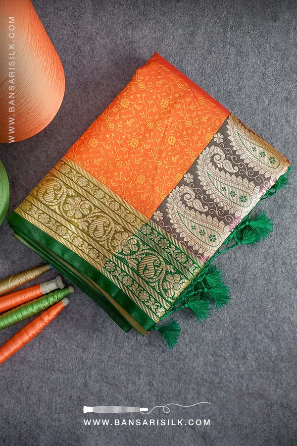 It is a yellow and red Banarasi Silk Saree woven in Tanchoi design, best for haldi and Indian weddings by bansarisilk.com